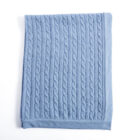 Blue cable knit cashmere baby knit blanket flat lay product photo
