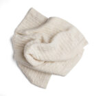 Ivory cashmere baby knit blanket showing soft drape and texture