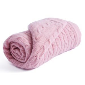 Pink cashmere baby knit blanket with cable knit pattern flat lay