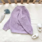 chunky knit baby sweater winter jumper side view or detail closeup photo