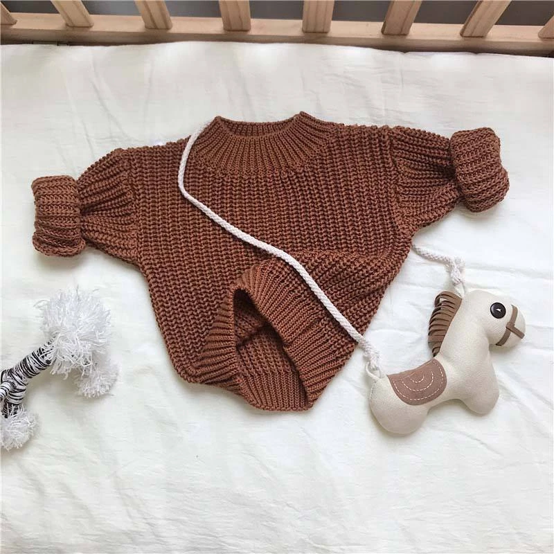 chunky knit baby sweater winter jumper texture and fabric detail photo