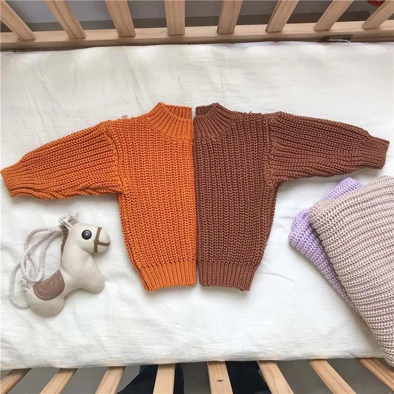chunky knit baby sweater winter jumper lifestyle or baby wearing photo