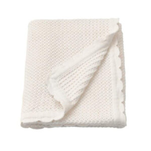 White cotton baby knit blanket with scallop edge flat lay