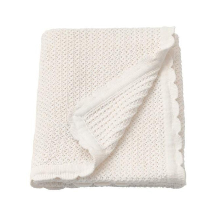 cotton-baby-knit-blanket-scallop-white-flat White cotton baby knit blanket with scallop edge flat lay