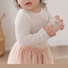 crochet knit baby girl vintage sweater side view or detail closeup photo