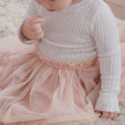 crochet knit baby girl vintage sweater texture and fabric detail photo