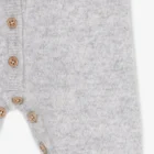 cashmere baby romper jumpsuit winter side view or detail closeup photo
