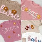 chunky knit baby sweater embroidered letter front view flat lay product photo
