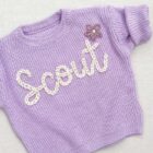 chunky knit baby sweater embroidered letter lifestyle or baby wearing photo