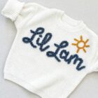 chunky knit baby sweater embroidered letter closeup detail product photo