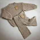chunky knit oversized speckled baby sweater set front view flat lay product photo