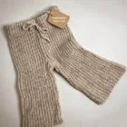 chunky knit oversized speckled baby sweater set side view or detail closeup photo