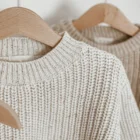 chunky knit speckle cotton baby sweater pullover back view flat lay product photo