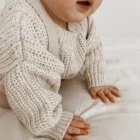 chunky knit speckle cotton baby sweater pullover texture and fabric detail photo