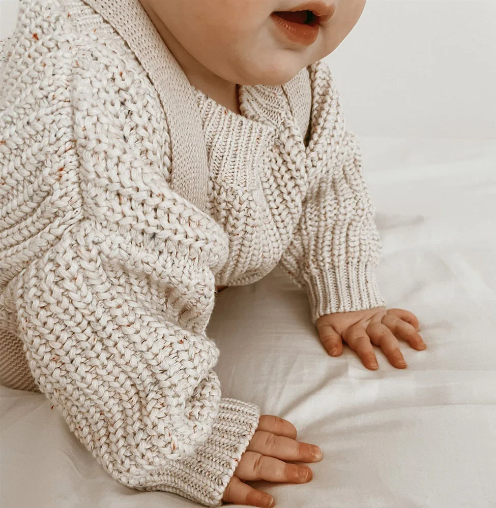 chunky knit speckle cotton baby sweater pullover texture and fabric detail photo