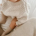 chunky knit speckle cotton baby sweater pullover lifestyle or baby wearing photo