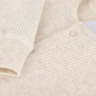 cotton bamboo baby romper sweater jumpsuit side view or detail closeup photo