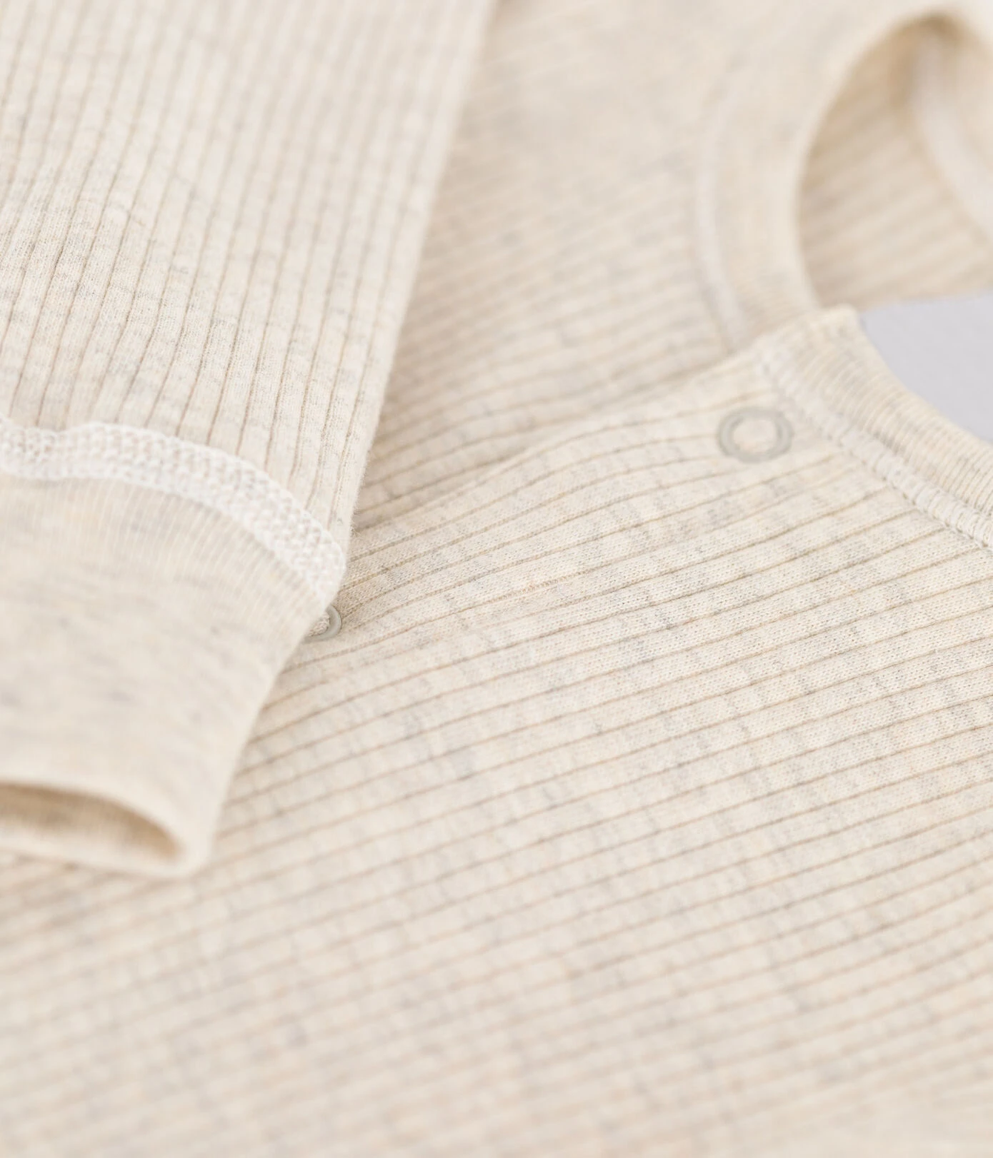 cotton bamboo baby romper sweater jumpsuit side view or detail closeup photo