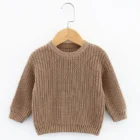 organic cotton baby jumper sweater front view flat lay product photo