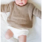 organic cotton baby jumper sweater lifestyle or baby wearing photo