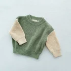 organic cotton chunky knitted baby sweater jumper side view or detail closeup photo