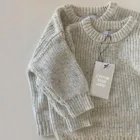 soft knitted baby sweater jumper winter front view flat lay product photo