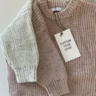 soft knitted baby sweater jumper winter back view flat lay product photo
