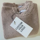 soft knitted baby sweater jumper winter texture and fabric detail photo