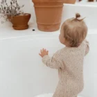 speckle cotton ribbed knit baby jumpsuit romper side view or detail closeup photo