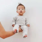 speckle cotton ribbed knit baby jumpsuit romper texture and fabric detail photo
