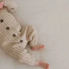speckle cotton ribbed knit baby romper front view flat lay product photo