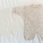 speckle knit baby romper sweater long sleeve front view flat lay product photo