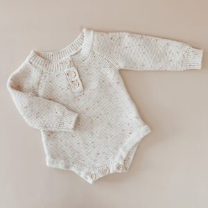 speckle knit cotton baby romper knitwear front view flat lay product photo