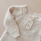speckle knit cotton baby romper knitwear side view or detail closeup photo