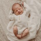 speckle knit cotton baby romper knitwear texture and fabric detail photo