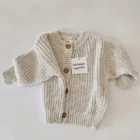 speckled chunky knit cardigan baby sweater back view flat lay product photo
