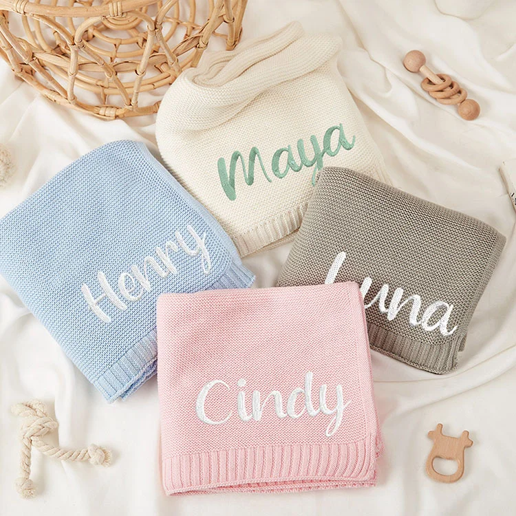 Knitted Baby Swaddle Wrap Blanket - Product Image 1 knitted baby swaddle wrap blanket front view flat lay product photo