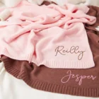 knitted baby swaddle wrap blanket back view flat lay product photo