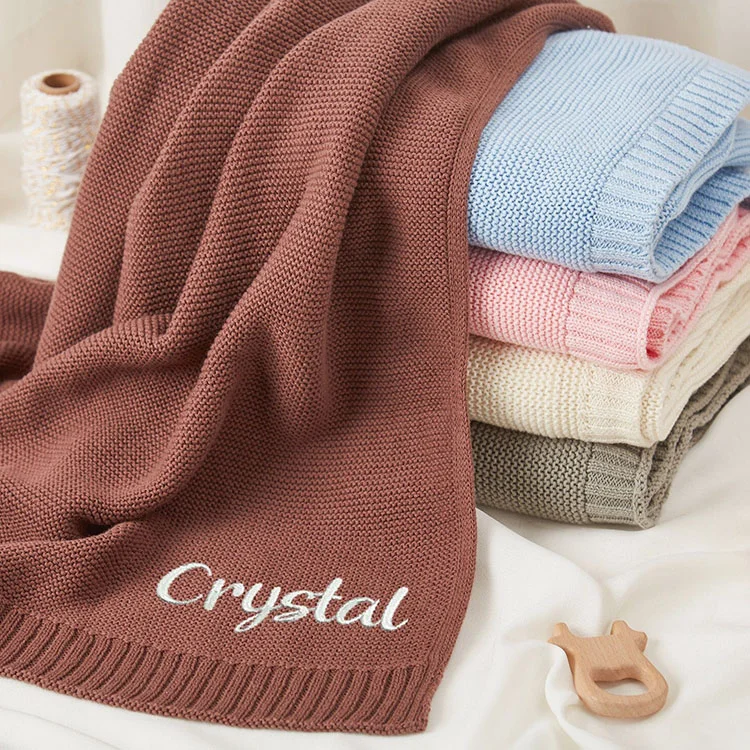 knitted baby swaddle wrap blanket side view or detail closeup photo