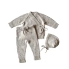 organic cotton baby cardigan pants set front view flat lay product photo