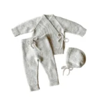 organic cotton baby cardigan pants set back view flat lay product photo