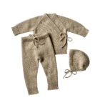 organic cotton baby cardigan pants set side view or detail closeup photo