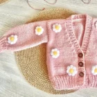 organic cotton baby girl cardigan sweater side view or detail closeup photo