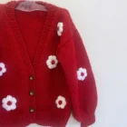 organic cotton baby girl cardigan sweater texture and fabric detail photo