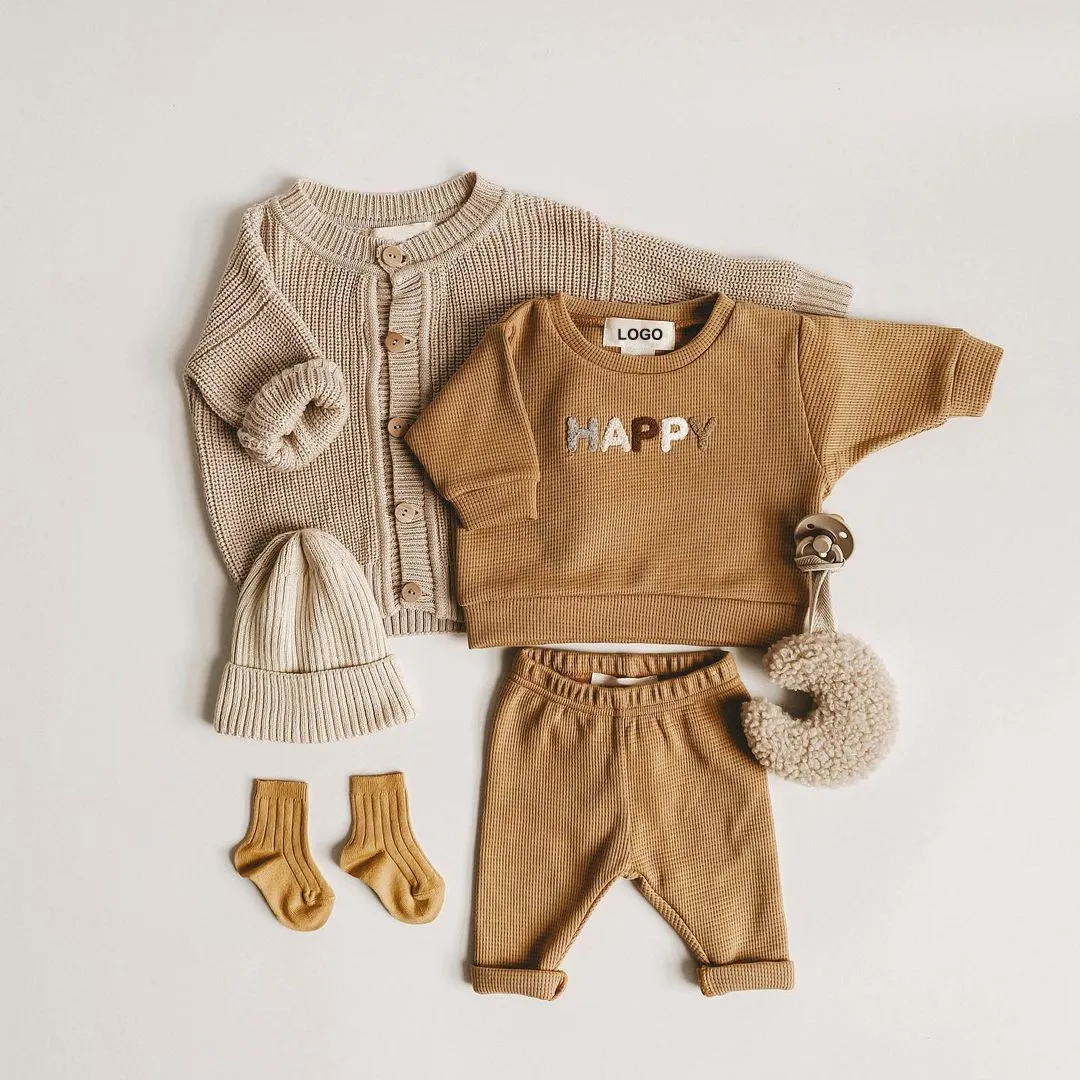 winter newborn baby knit jogger set side view or detail closeup photo