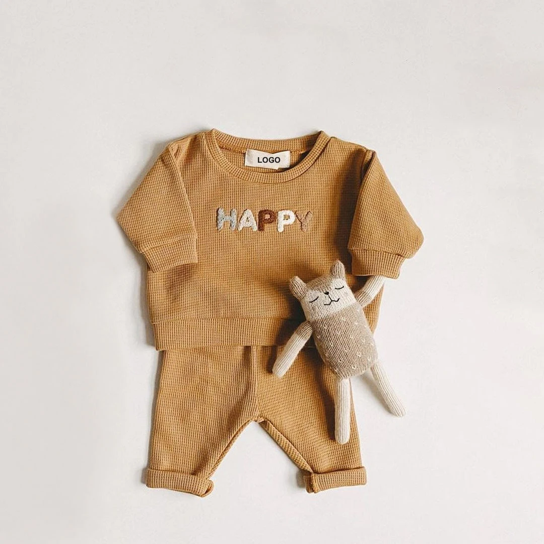 winter newborn baby knit jogger set texture and fabric detail photo