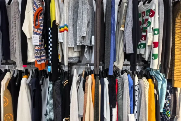HDL Fashion showroom displaying a wide range of custom sweater and knitwear samples.