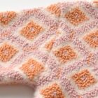 chenille diamond knit baby jumper sweater texture closeup