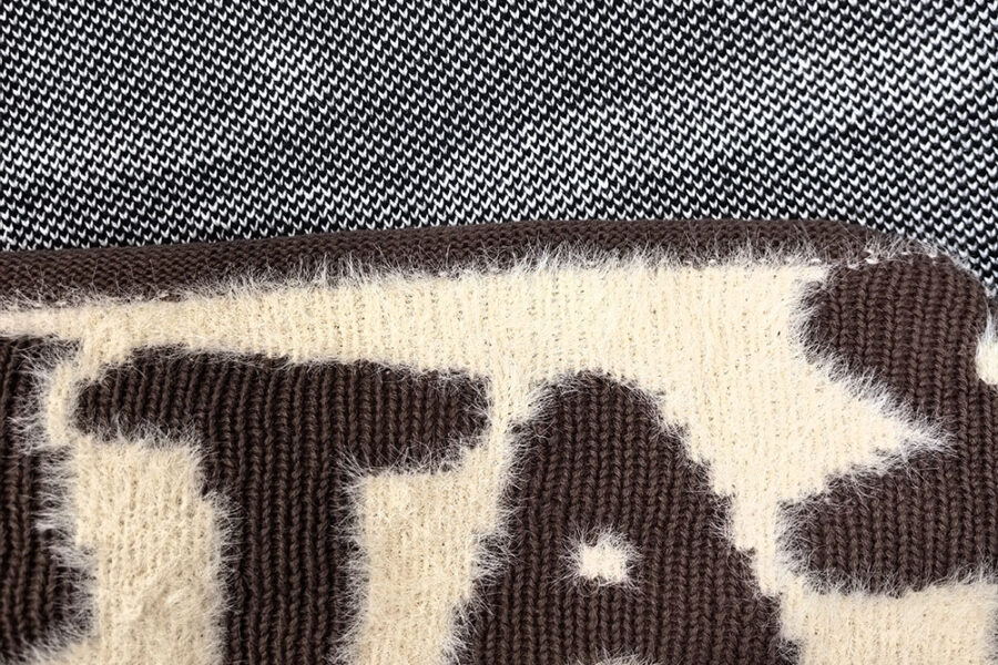 Close-up comparison of jacquard and intarsia knitwear showing different yarn and pattern structures