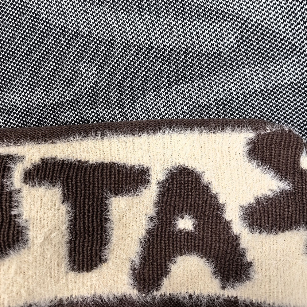 Close-up comparison of jacquard and intarsia knitwear showing different yarn and pattern structures